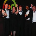 The Blue Skies team receiving a CSR Excellence Award presented by Sue Perkins